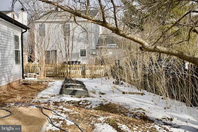 view of yard covered in snow