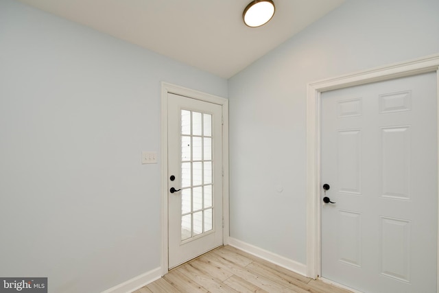 entryway featuring plenty of natural light and light hardwood / wood-style floors