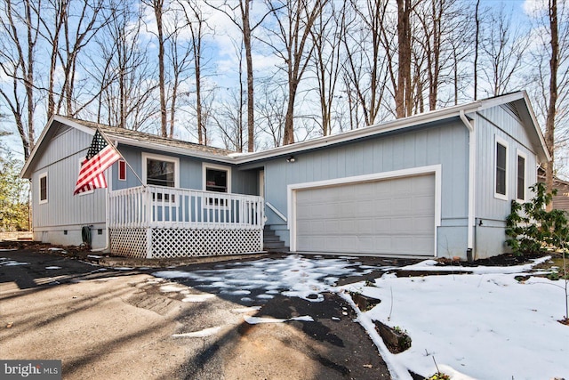 view of front of property featuring a garage and covered porch