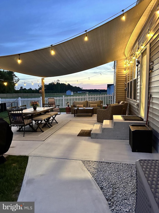 patio terrace at dusk with outdoor lounge area