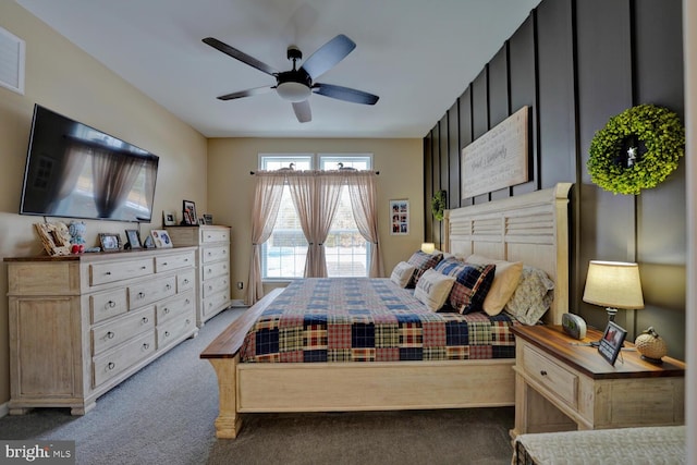 bedroom featuring ceiling fan and dark colored carpet