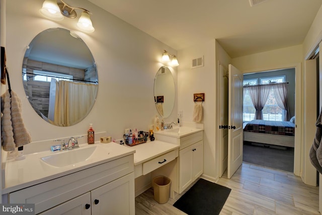 bathroom featuring vanity and a shower with curtain