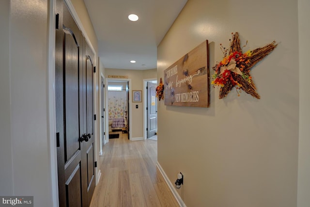 hall with light wood-type flooring