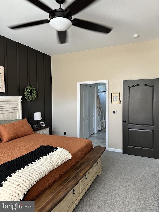 bedroom featuring light colored carpet and ceiling fan