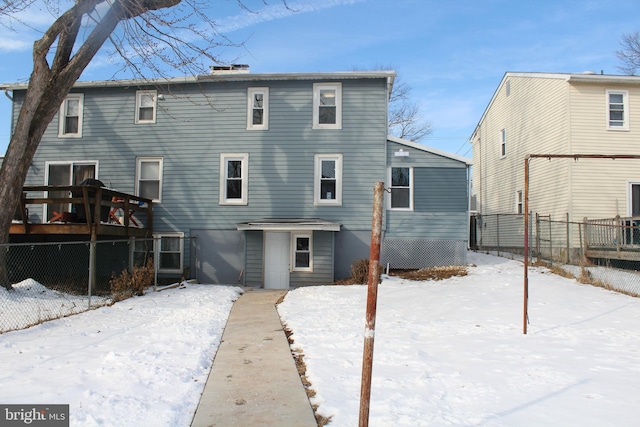 view of snow covered house