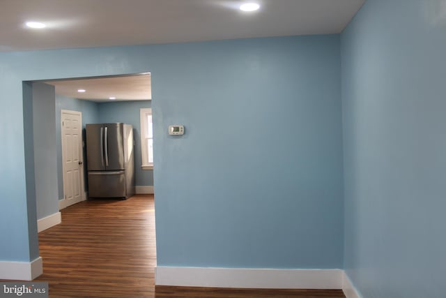 hall with dark hardwood / wood-style floors