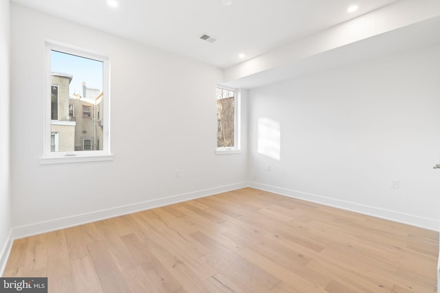 unfurnished room with light hardwood / wood-style flooring