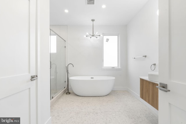 bathroom with vanity, separate shower and tub, and a notable chandelier