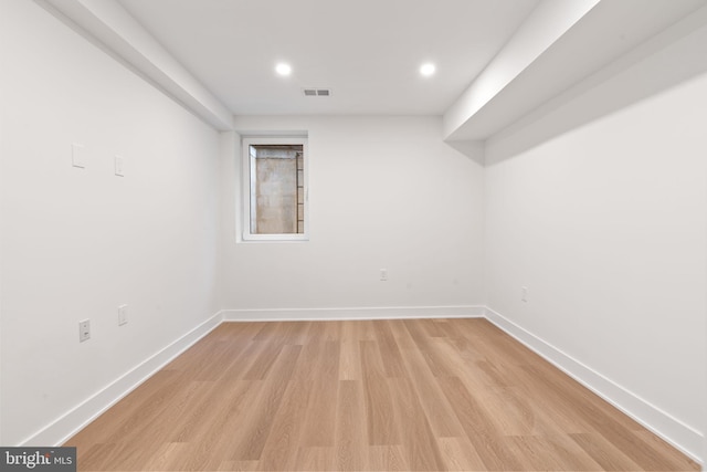 empty room with light hardwood / wood-style floors