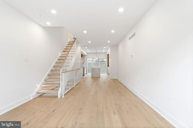 hall featuring light hardwood / wood-style flooring