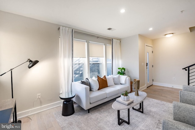 living room with light hardwood / wood-style flooring