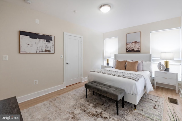 bedroom with light hardwood / wood-style floors