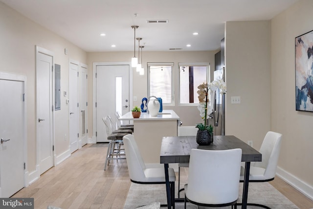 dining space featuring light hardwood / wood-style flooring