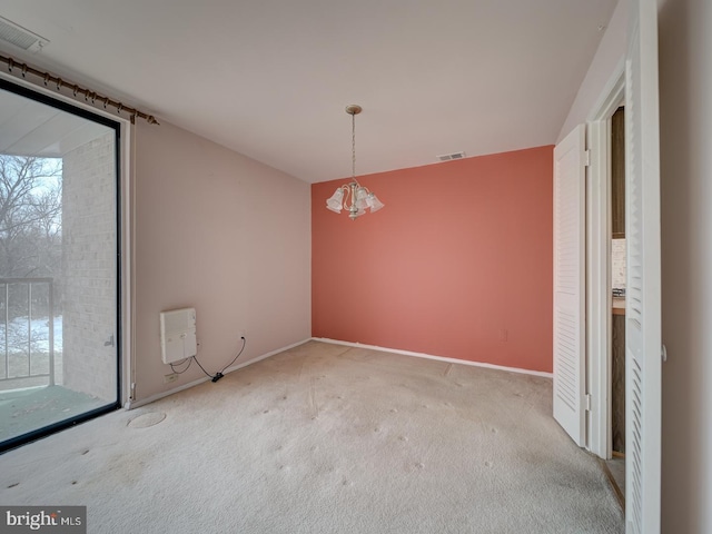 spare room featuring carpet flooring