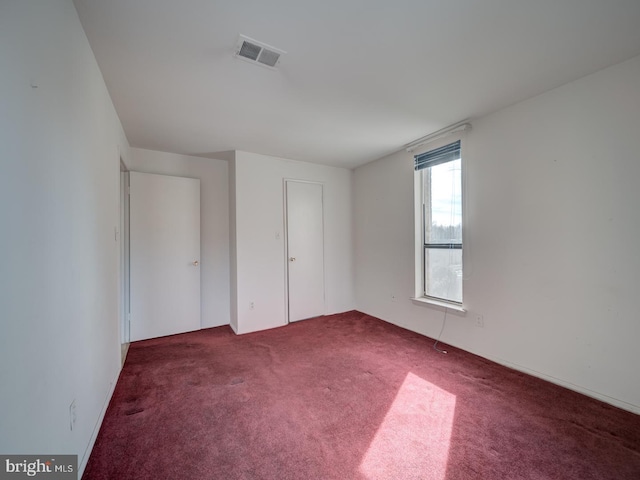 unfurnished bedroom featuring carpet flooring