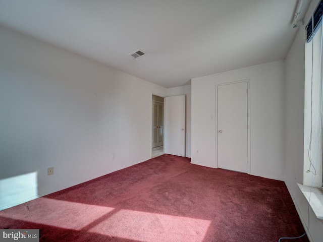 unfurnished bedroom featuring carpet flooring