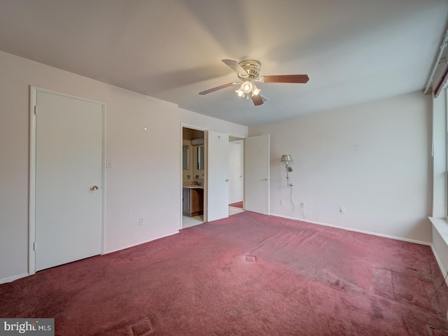 unfurnished bedroom with ceiling fan, ensuite bath, and carpet