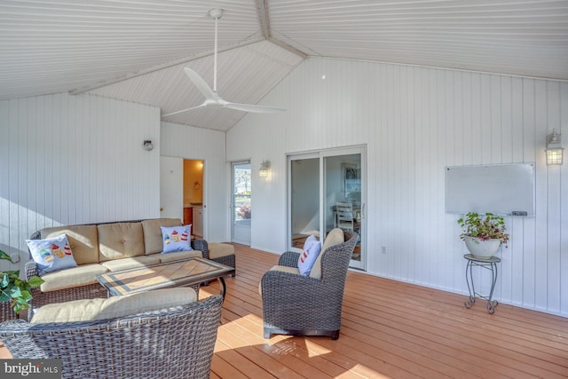 living room with ceiling fan, high vaulted ceiling, and light wood-type flooring