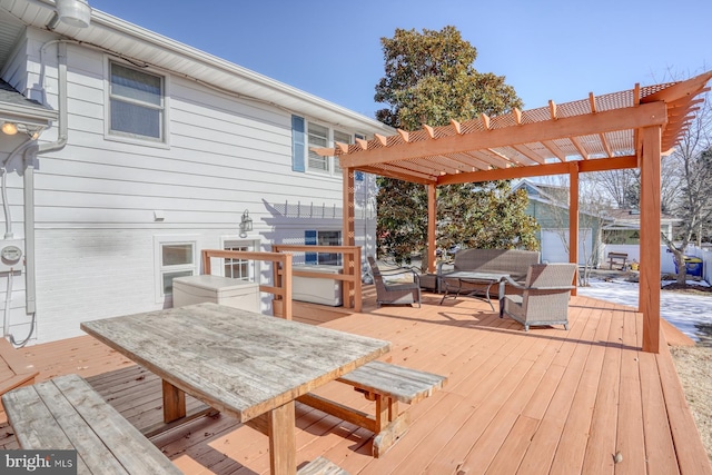 deck with an outdoor hangout area and a pergola