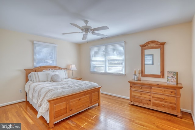 bedroom featuring light hardwood / wood-style flooring and ceiling fan