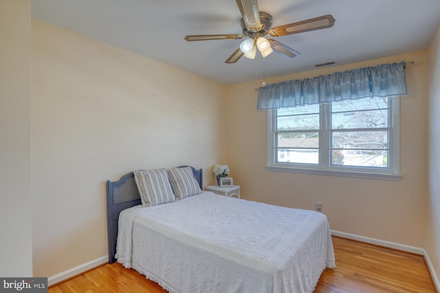 bedroom featuring light hardwood / wood-style flooring and ceiling fan