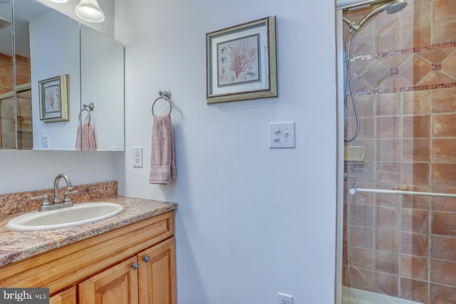 bathroom with vanity and an enclosed shower