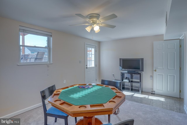 playroom featuring light carpet and ceiling fan