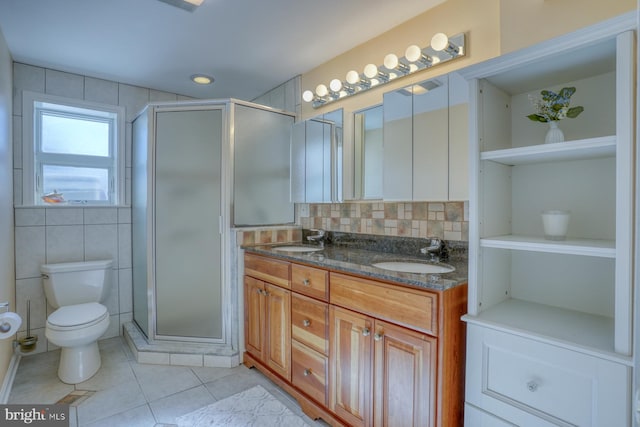 bathroom with vanity, backsplash, tile patterned floors, and walk in shower