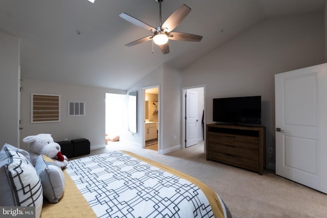 bedroom featuring ensuite bathroom, high vaulted ceiling, light colored carpet, and ceiling fan