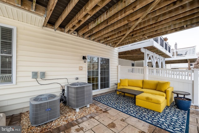 view of patio with central AC and outdoor lounge area