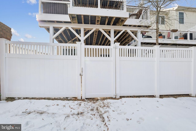 view of snow covered gate