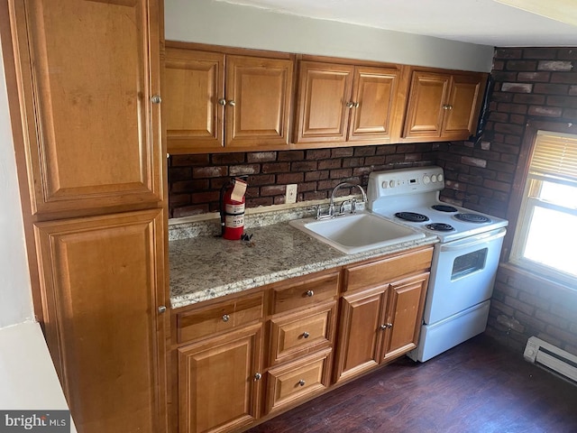 kitchen with sink, baseboard heating, white range with electric cooktop, light stone countertops, and dark wood-type flooring