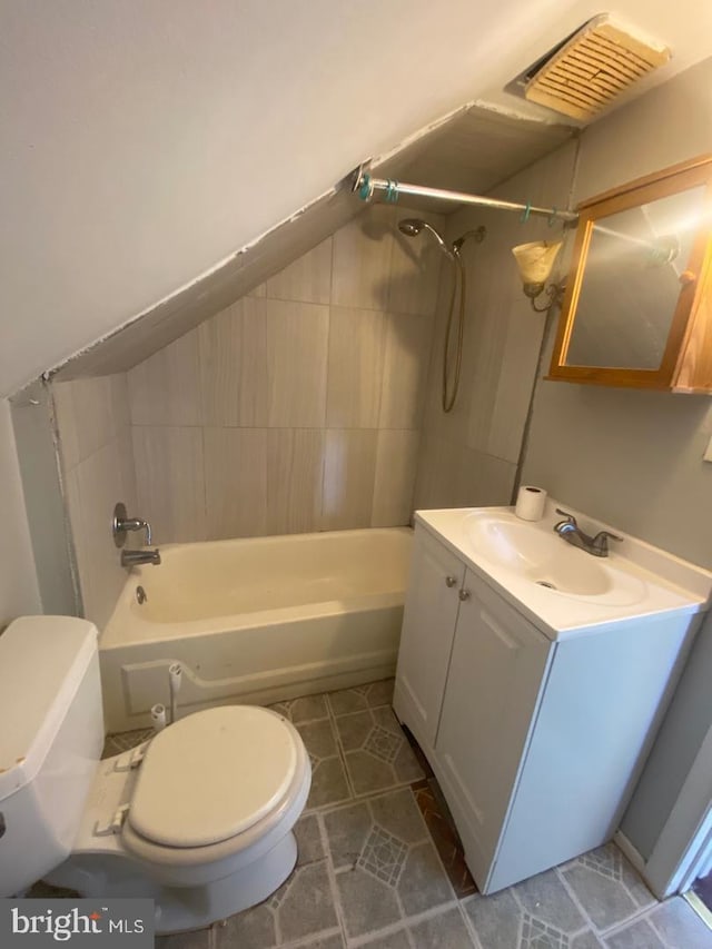 full bathroom featuring vanity, toilet, and tiled shower / bath combo