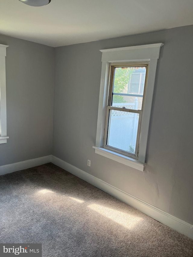 empty room featuring carpet flooring