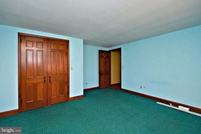 unfurnished bedroom featuring a closet, baseboards, and carpet