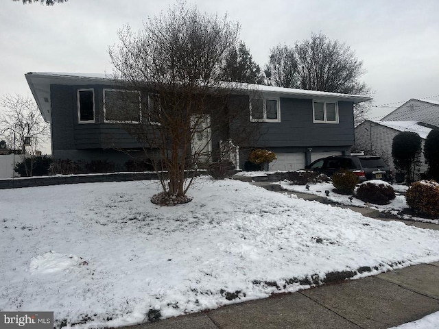 split foyer home featuring a garage