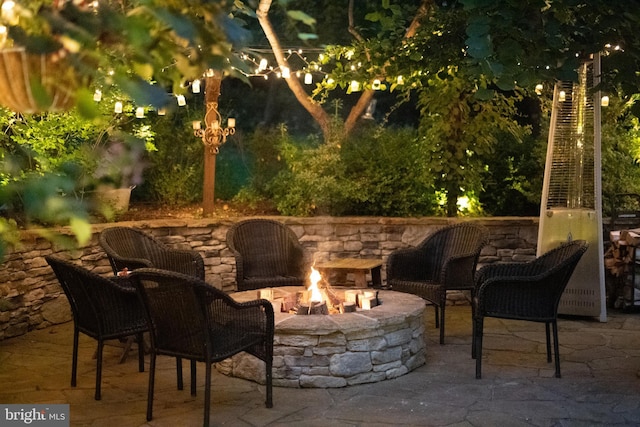 view of patio / terrace with an outdoor fire pit