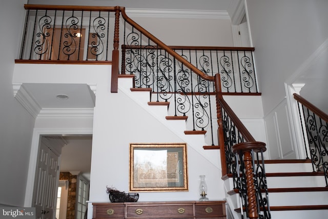 stairway with crown molding