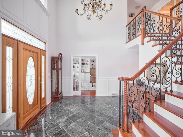 foyer with a towering ceiling