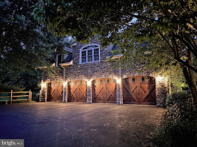 view of gate at twilight