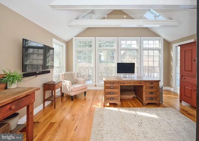 office area featuring light hardwood / wood-style flooring and vaulted ceiling with beams