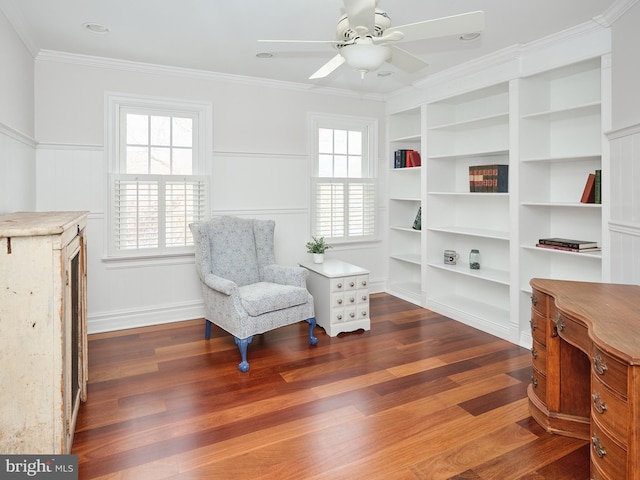 sitting room with dark hardwood / wood-style flooring, crown molding, a wealth of natural light, and ceiling fan