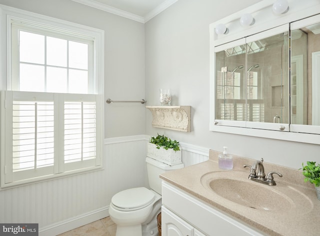 bathroom with ornamental molding, plenty of natural light, an enclosed shower, and vanity