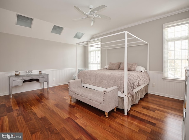 bedroom featuring ceiling fan, crown molding, and dark hardwood / wood-style flooring