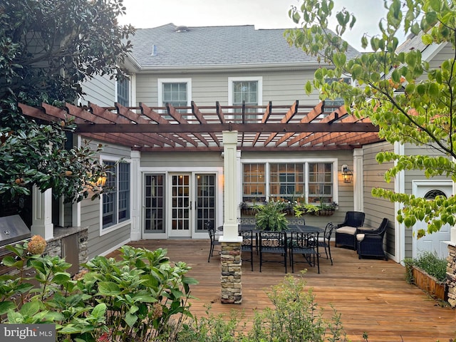 wooden deck with outdoor lounge area and a pergola