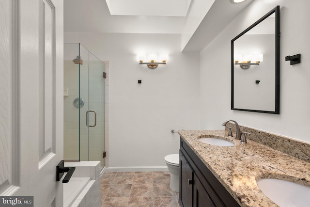 bathroom featuring vanity, an enclosed shower, and toilet