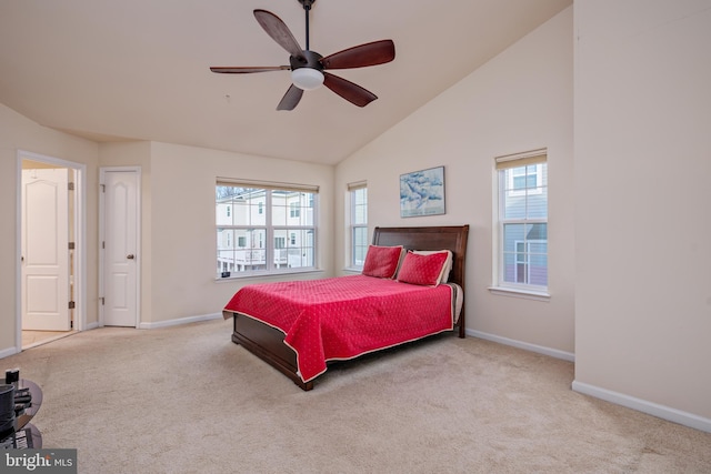 bedroom with ceiling fan, multiple windows, and light colored carpet