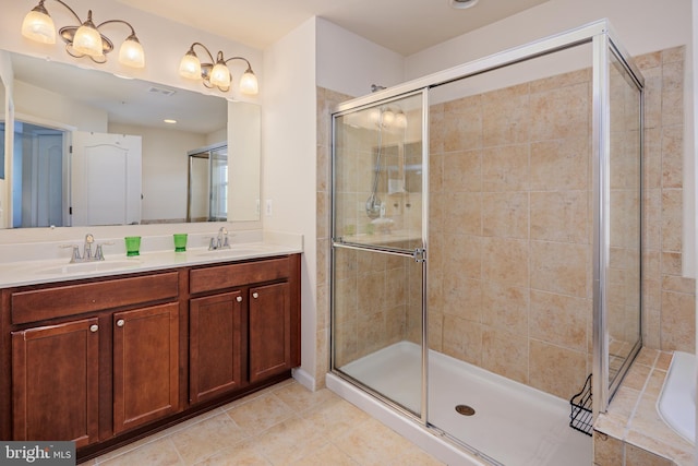 bathroom featuring plus walk in shower, tile patterned flooring, and vanity