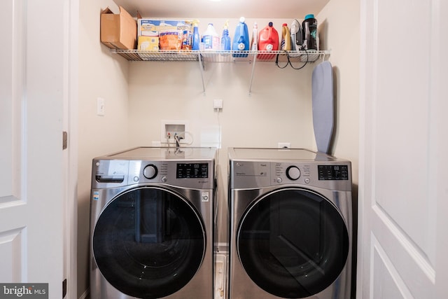 washroom with independent washer and dryer