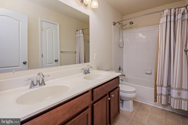 full bathroom with shower / bath combo with shower curtain, vanity, tile patterned flooring, and toilet